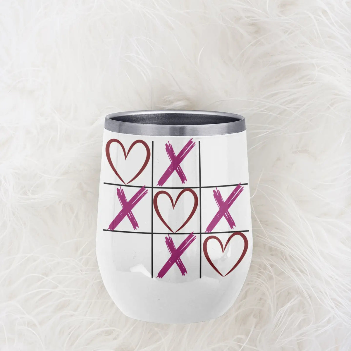 XOXO wine tumbler on faux fur surface